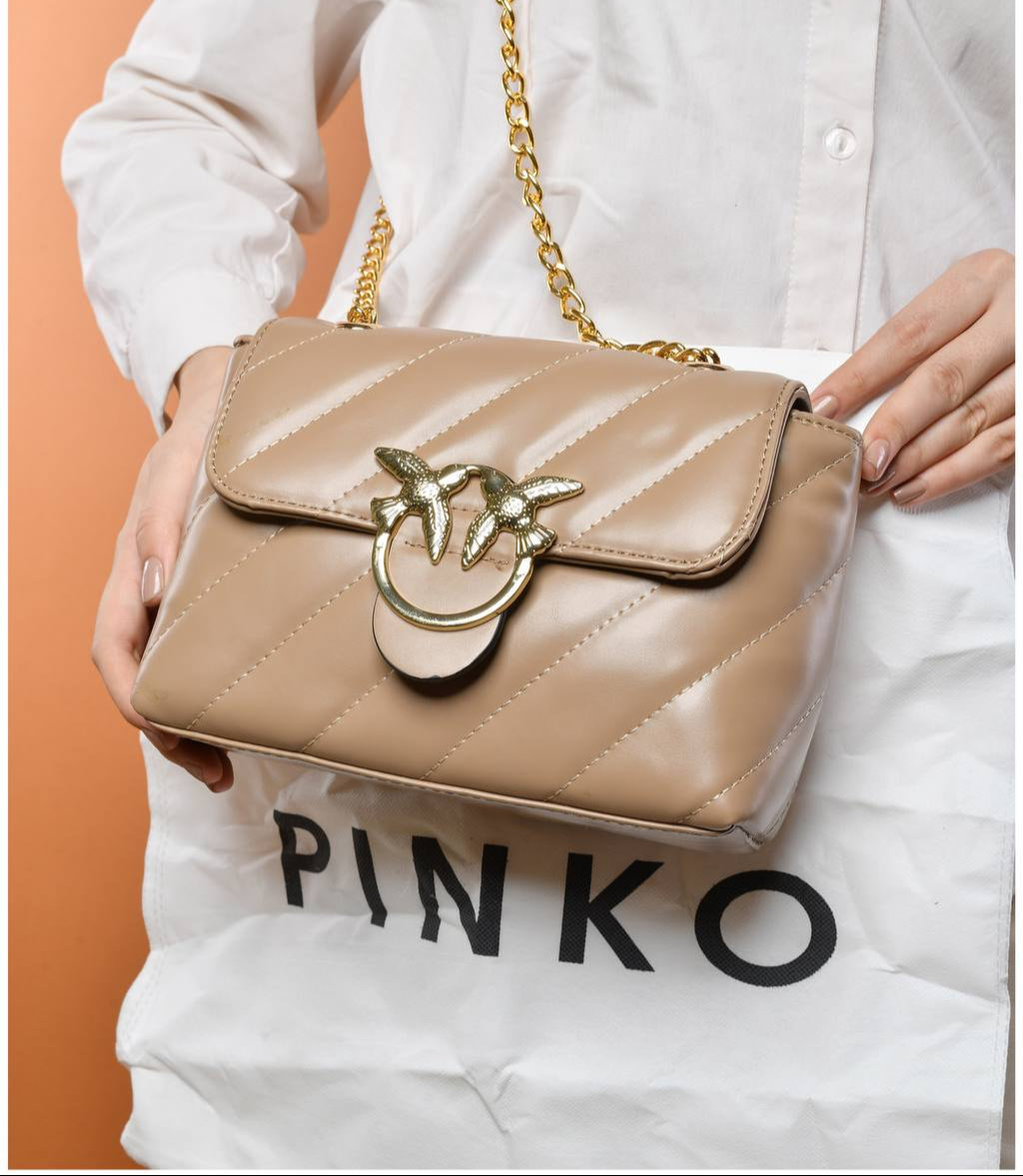 gold accessorized trendy bag