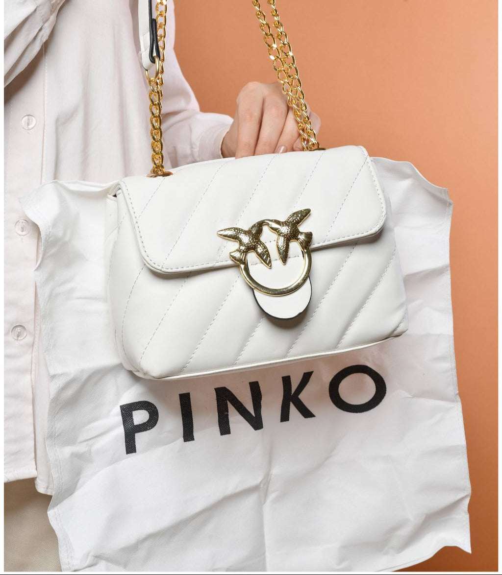 gold accessorized trendy bag