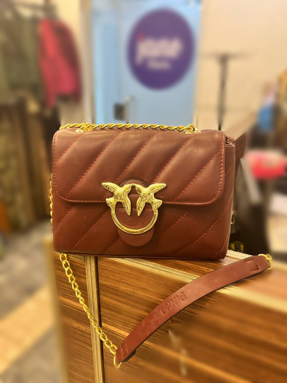 gold accessorized trendy bag