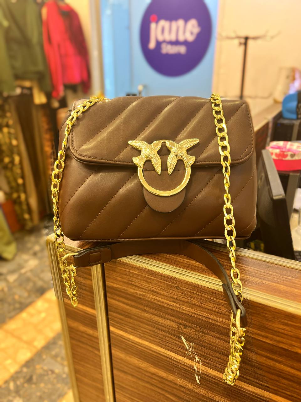 gold accessorized trendy bag
