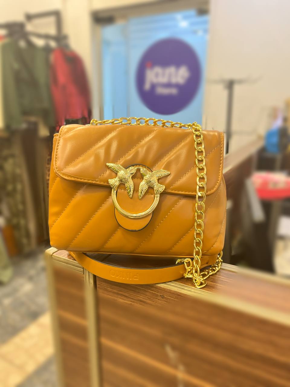 gold accessorized trendy bag