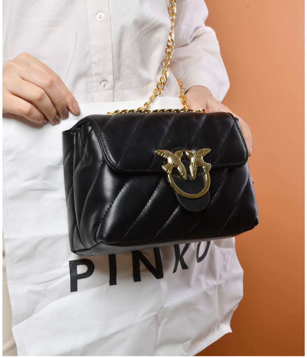 gold accessorized trendy bag