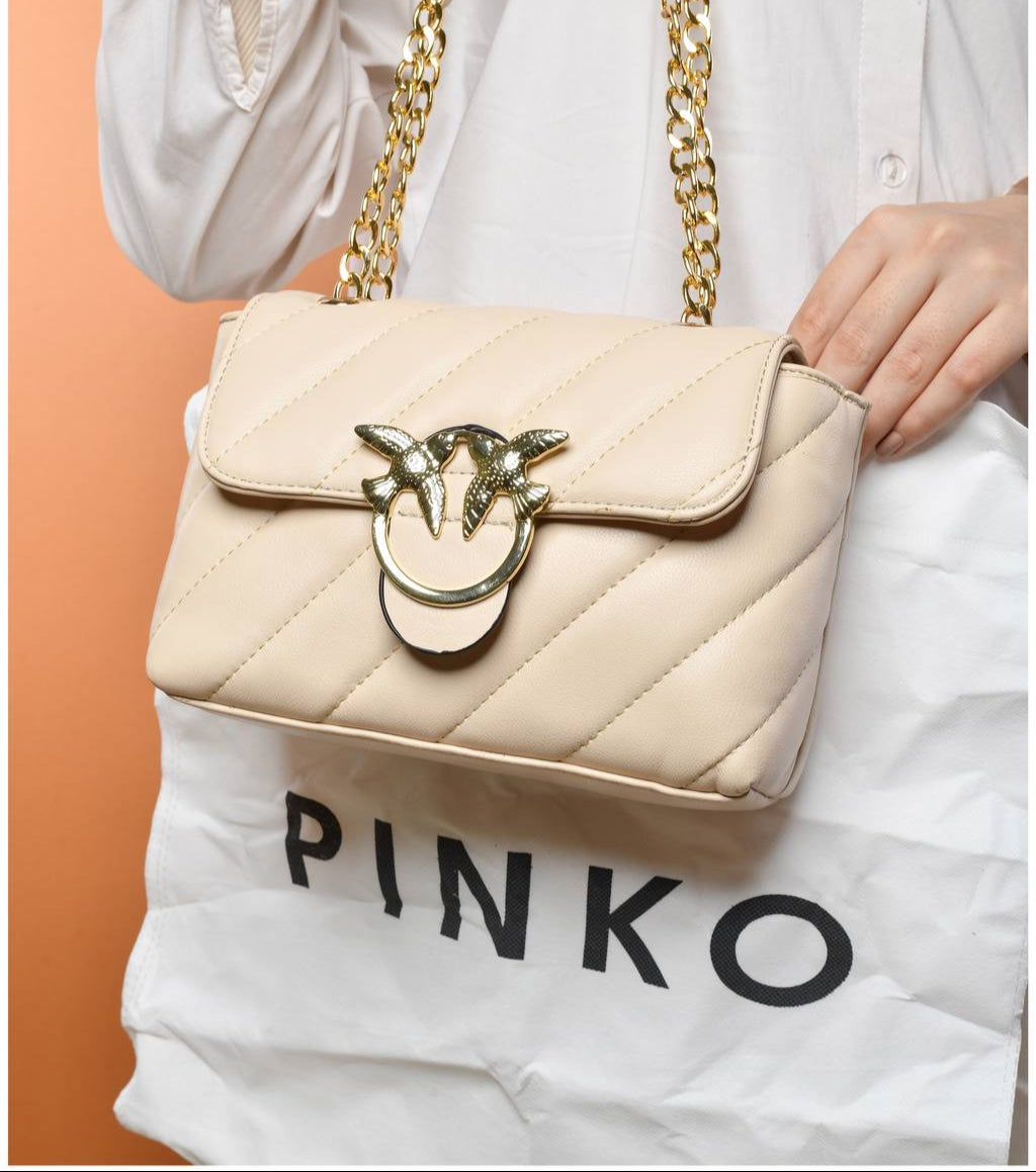 gold accessorized trendy bag