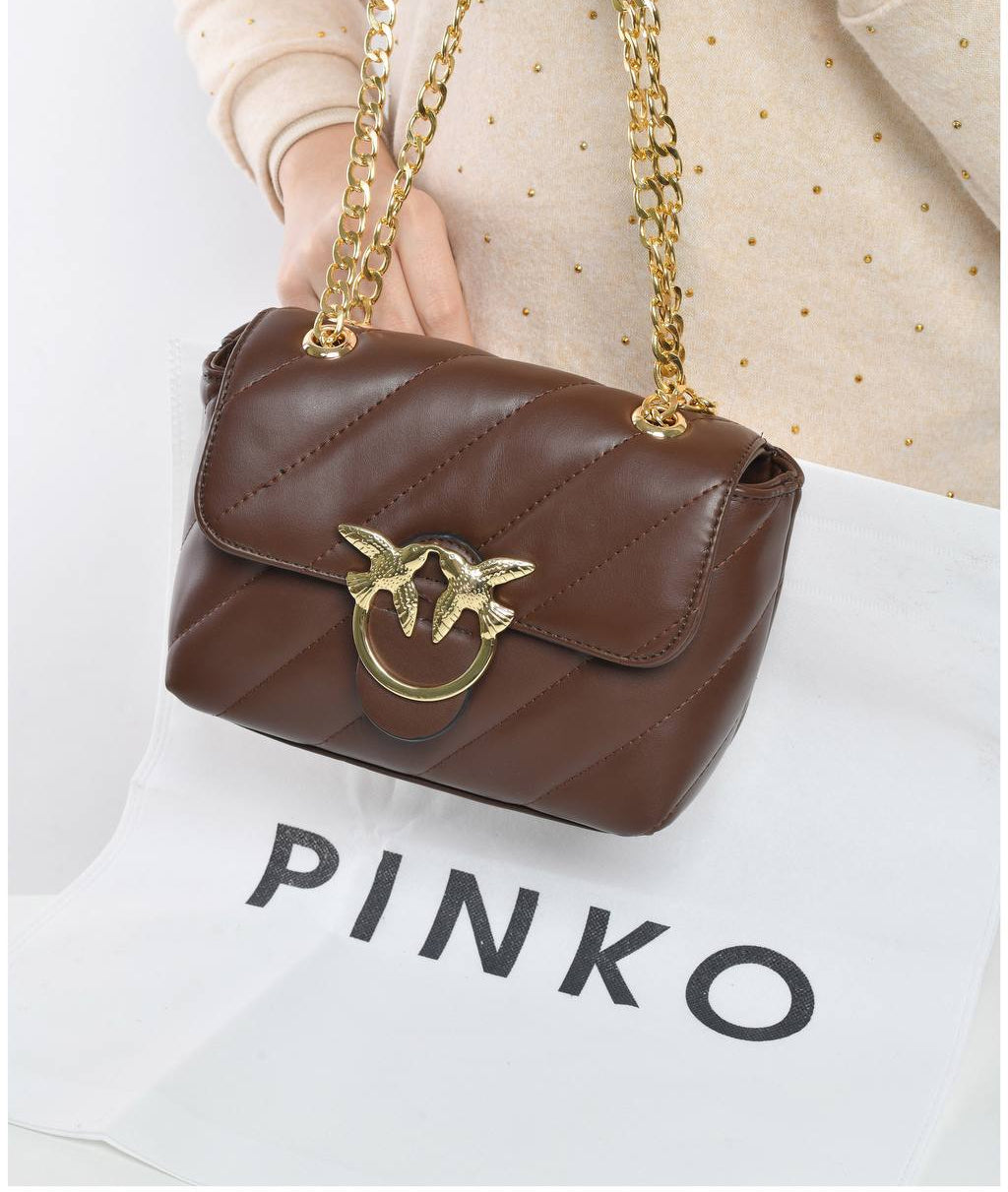 gold accessorized trendy bag