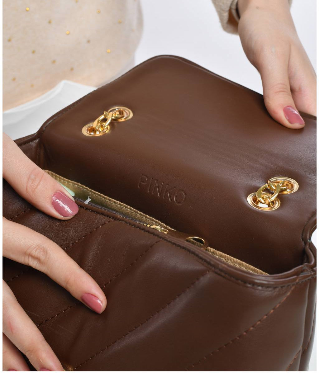 gold accessorized trendy bag