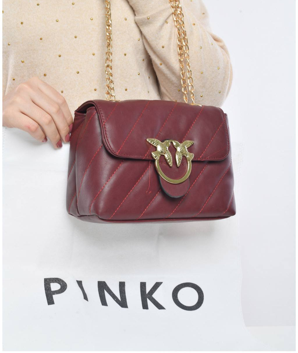 gold accessorized trendy bag