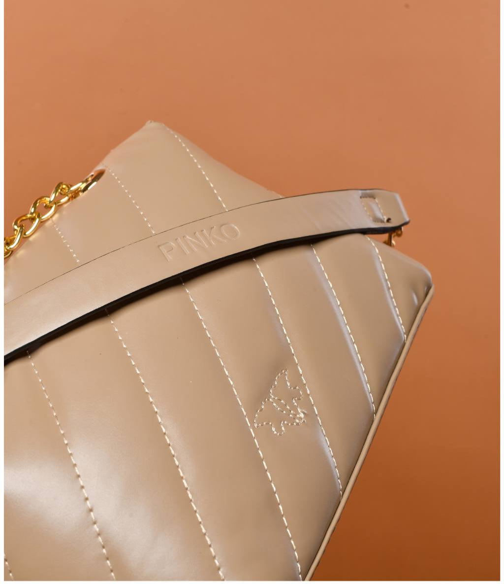 gold accessorized trendy bag